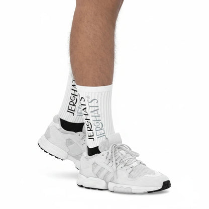 JERGHATS crew socks with white ribbed leg and black cushioned foot worn with white sneakers