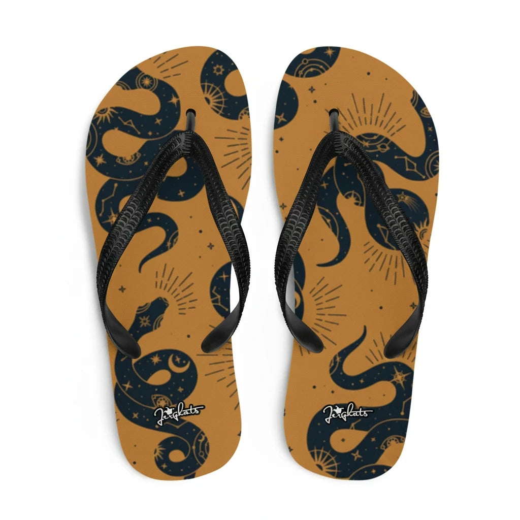 JERGHATS flip-flops with a tan rubber sole, black Y-shaped straps, and a celestial snake pattern in black.