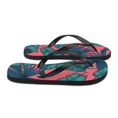 JERGHATS flip-flops featuring a pink background with teal tropical leaf patterns, black rubber soles, and Y-straps.