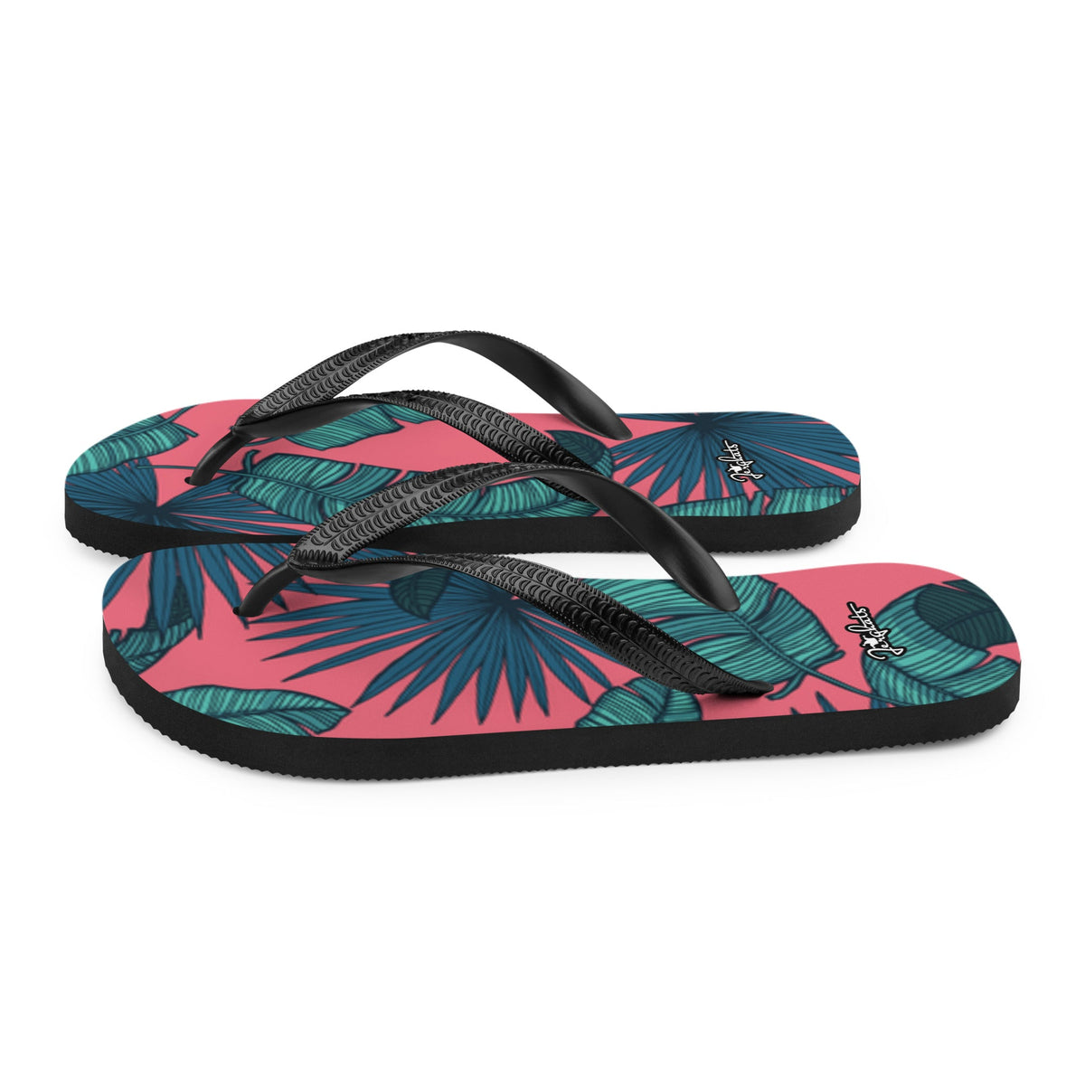 JERGHATS flip-flops featuring a pink and teal tropical leaf pattern with black rubber straps and a soft fabric lining.